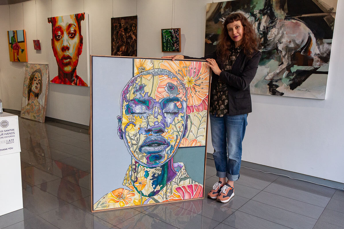 Anina Deetlefs with her painting 'Amani'